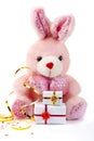 Toy pink rabbit with gifts
