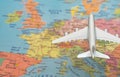 Plane flying over the Europe map Royalty Free Stock Photo