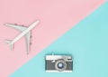 Toy plane and vintage camera on pink and blue Royalty Free Stock Photo