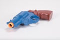 Toy plastic gun close up with white copy space Royalty Free Stock Photo