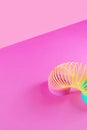 Toy plastic rainbow on a pastel pink background. Royalty Free Stock Photo