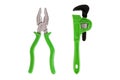 Toy pliers and an adjustable wrench with a green handle. On a white background, isolated Royalty Free Stock Photo