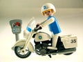 Toy policeman on bike Royalty Free Stock Photo