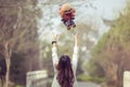 Toy Poodle playing with its female master in a park Royalty Free Stock Photo