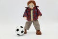 toy puppet doll with a soccer ball