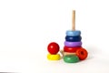 Toy pyramid, wooden, multi - colored rings, on a white background