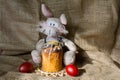 Toy rabbit, Easter cake and color eggs on a table Royalty Free Stock Photo