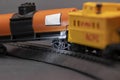 Toy train derailed, close-up. Concept: train wreck, train crash and accident. Royalty Free Stock Photo