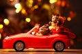 Toy red car squirrel family