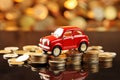 Toy red car top of a stack of coins on a table with bokeh background Royalty Free Stock Photo