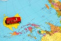 toy red car on the world map in Australia, caravanning