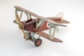 Toy red and white airplane made of wood on a white background Royalty Free Stock Photo