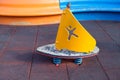 Children playground equipment, windsurfer toy for kids, close view from high angle