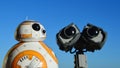 Toy robot fiends Sphero BB8 from Star Wars and LEGO Wall-E from Disney Pixar movie sunbathing on daylight sunshine,