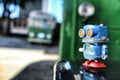 Toy robot on old bus school Royalty Free Stock Photo