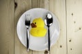 Toy rubber duck on a plate Royalty Free Stock Photo