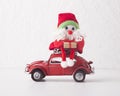 Toy Santa with presents driving on car Volkswagen Beetle on white background