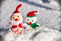 Toy Santa and snowman in the snow Royalty Free Stock Photo