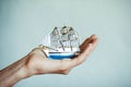 Toy ship in hands Royalty Free Stock Photo