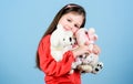 Toy shop. childrens day. Best friend. small girl with soft bear toy. child psychology hugging a teddy bear. little girl Royalty Free Stock Photo
