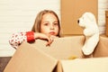 After toy shop. happy child cardboard box. purchase of new habitation. happy little girl with toy. repair of room. new Royalty Free Stock Photo