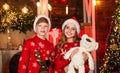 Toy shop. this is for you. children santa hat share gifts. happy family portrait. kids play with bear toy in decorated
