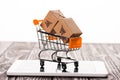 toy shopping cart with small carton Royalty Free Stock Photo