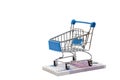 Toy shopping cart is on a stack of 500 euro bills Royalty Free Stock Photo