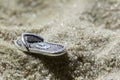 Toy Slap in the Sand.Beach slippers in the sand Royalty Free Stock Photo