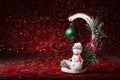 New Year card. Christmas picture with a toy snowman on a red background. Royalty Free Stock Photo