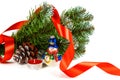 Toy snowman under a branch of an artificial Christmas tree with the cone Royalty Free Stock Photo