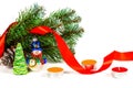 Toy snowman under a branch of an artificial Christmas tree with the cone Royalty Free Stock Photo