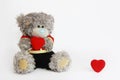 Toy soft bear holding a red heart