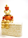 Toy soldier bear perched on Christmas gift