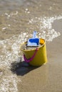 Toy Spade and Bucket on a Beach Shore Royalty Free Stock Photo