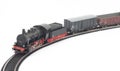 Toy steam locomotive and freight cars on white Royalty Free Stock Photo