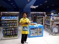 A toy store employee demonstrates how to fly a toy drone.
