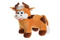 Toy stuffed cow puppet isolated at white background. Symbol of chinese new year. Cuddly toy animal