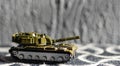 Toy tank with camouflage color. Military vehicles toy. Simple cheap toys for children, warfare, warzone vehicles Royalty Free Stock Photo