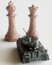 Toy tanks with chess on chessboard. Concept of military strategy. - 3D Rendering