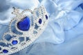 Toy tiara with diamonds and blue gem Royalty Free Stock Photo