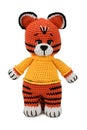 Toy tiger. Soft, crocheted toy in a yellow sweater. Isolated on white background Royalty Free Stock Photo