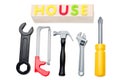 Toy tools and house sign Royalty Free Stock Photo