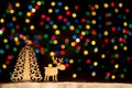 Toy town - Xmas lights stars, Christmas tree, vintage wooden dec Royalty Free Stock Photo