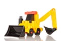 Toy tractor loader excavator yellow, isolated on a white background