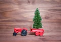 Toy tractor with a miniature Christmas tree