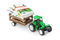 Toy tractor with money Royalty Free Stock Photo