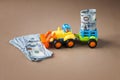 Toy tractor with money Royalty Free Stock Photo