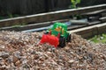 Toy tractor on a pile of rubble, kids game