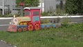 Toy train with flower-bed cars Royalty Free Stock Photo